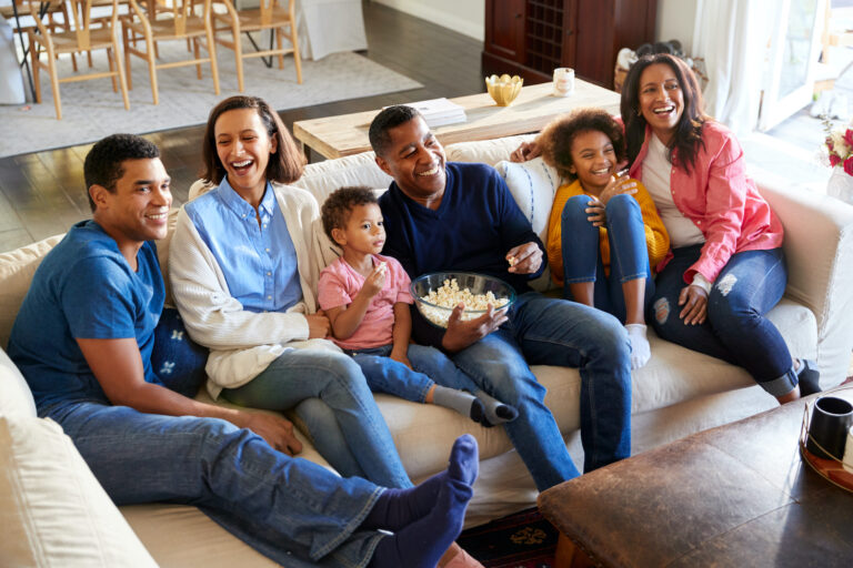 a family sitting on a couch