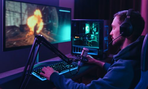 Young pro cyber streamer playing online video games Young pro cyber streamer playing online video games